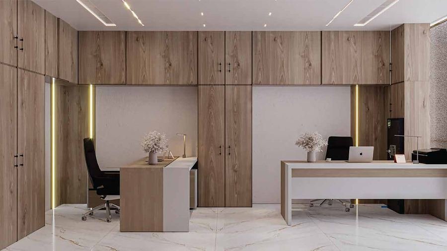 Open office area with oak wall cladding and marble flooring at Almadina Co.