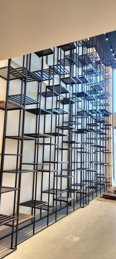 Black steel lattice display shelving at Dessert Garden in Al Khobar
